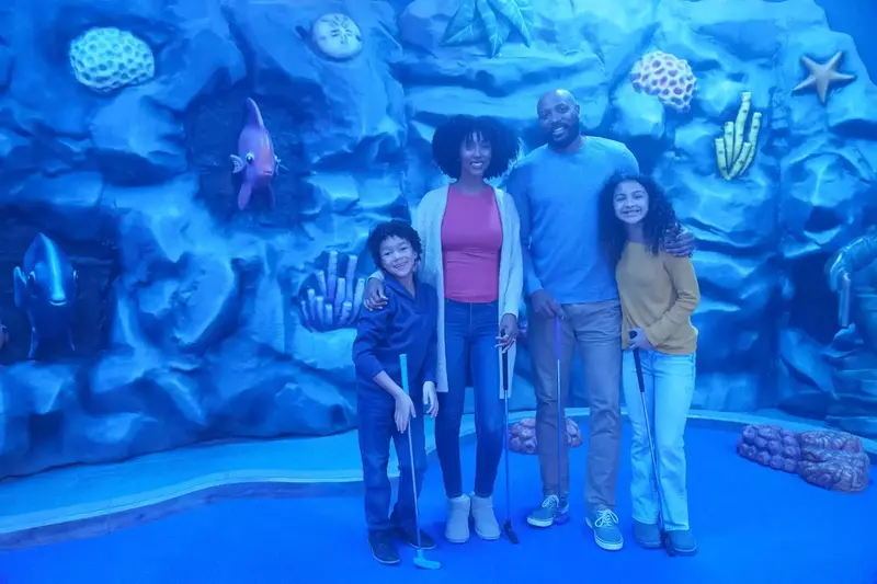 family on the mermaid course indoors