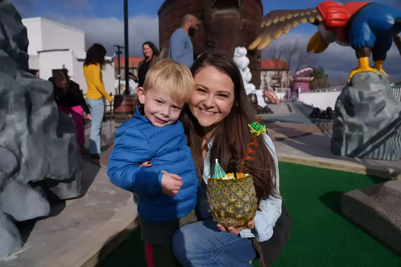 Mom and son with pineapple Dole Whip