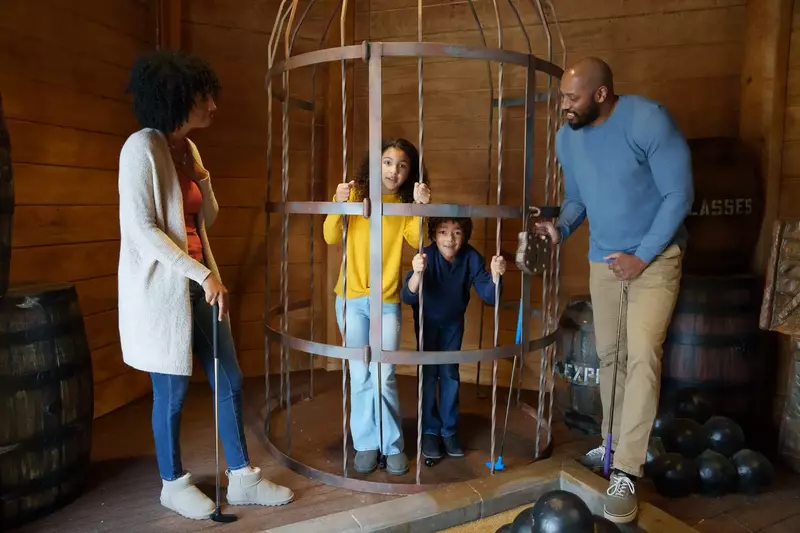 family in photo op on pirates course
