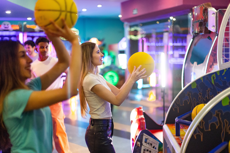 girls playing basketball games in the arcade