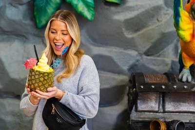 person with Dole pineapple float